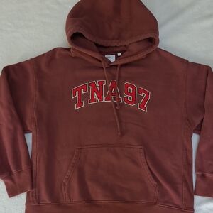 TNA Women's Hoodie in Rich Brown with Red Lettering